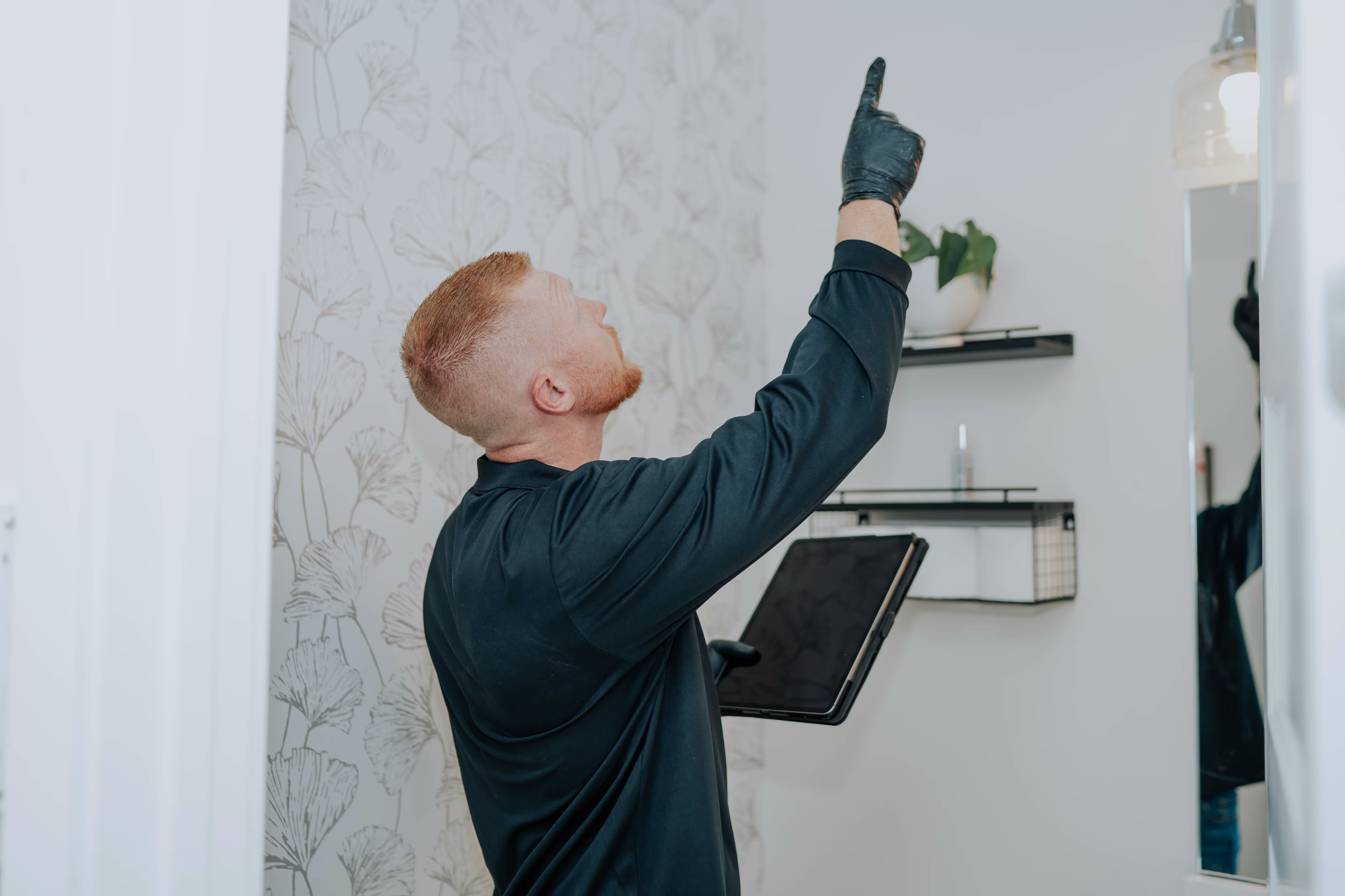 NY Mold & Clean Air Solutions specialist inspecting a property